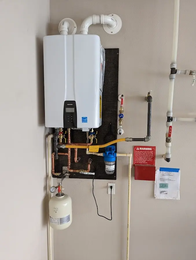 Professional plumber installing copper piping in a Oviedo home